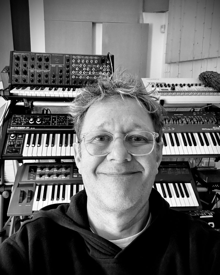 Jonny Gunton in his studio in Bristol, in front of his synthesisers